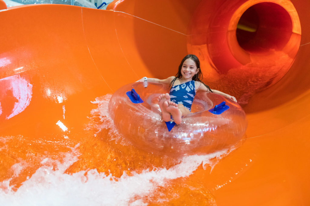 Image of girl going down a water slide  at Kalahari Waterpark. 